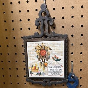 Vintage cast iron trivet with Autumn Design
